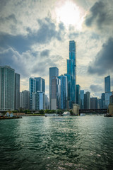 Fototapeta premium View of Chicago skyline against a backdrop of dramatic clouds. Buildings along the mouth of the Chicago river.