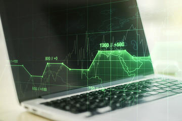 Multi exposure of stats data illustration on modern laptop background, computing and analytics concept