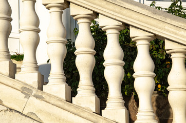 Classic antique stone railings with white balusters. Travel and adventure.
