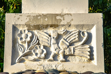 Ceramic bas-relief, stone carving mythical image birds as an element of the building.