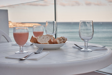dinner preparation on a terrace with palm trees and sea views
