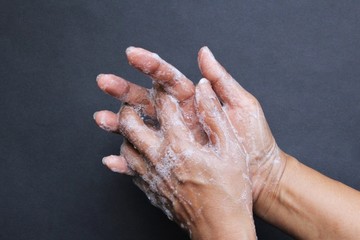 Fototapeta premium Washing hand with soap photo isolate on black top view copy space 