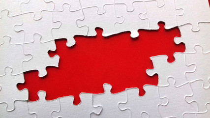 puzzle with missing pieces, space to write a message in red