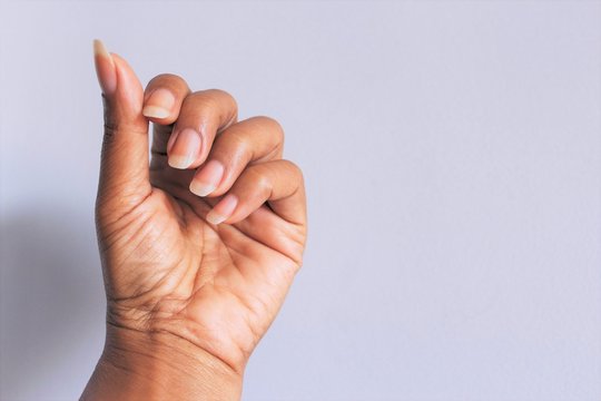 Women hand showing clean fingernails, photo isolate on white front view 