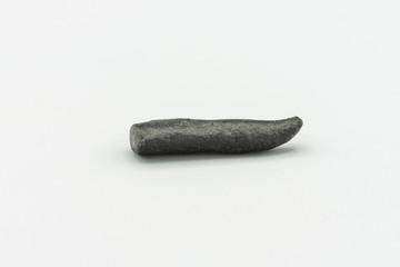 Black magnetic Atacaimite Tektite Meteorite isolated, a rock formed in a big meteorite collision at...