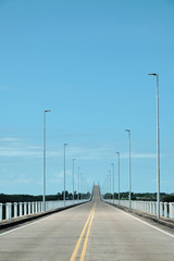 a view from the road of a bridge in the frontier between argentina and uruguay