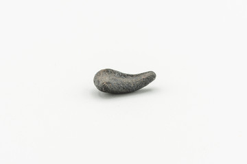Black magnetic Atacaimite Tektite Meteorite isolated, a rock formed in a big meteorite collision at...