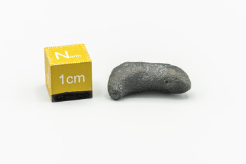 Black magnetic Atacaimite Tektite Meteorite isolated, a rock formed in a big meteorite collision at...