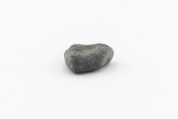 Black magnetic Atacaimite Tektite Meteorite isolated, a rock formed in a big meteorite collision at...