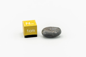 Black magnetic Atacaimite Tektite Meteorite isolated, a rock formed in a big meteorite collision at...