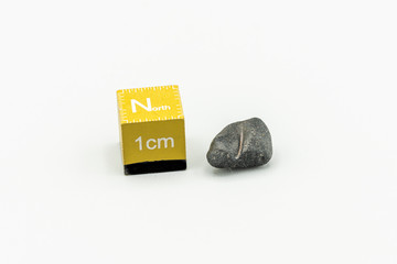 Black magnetic Atacaimite Tektite Meteorite isolated, a rock formed in a big meteorite collision at...