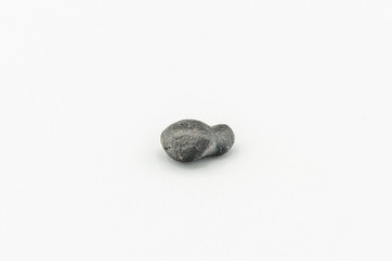 Black magnetic Atacaimite Tektite Meteorite isolated, a rock formed in a big meteorite collision at...
