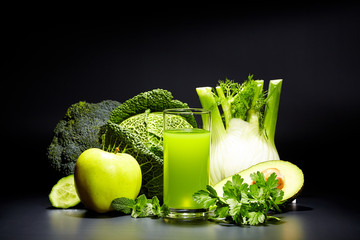 healthy vegetable juices for refreshment and as an antioxidant . Black background