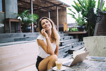 Female smiling while talking on cellphone
