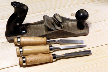 Old jake plane and chisels. Assortment of chisel of wood for carpentry.