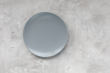 Empty plate on gray background. Cooking, meal and food concept. Top view, flat lay, copy space