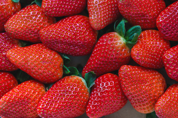 Fresh harvested strawberries background, concept of healthy eating vegan food. Close up, selective focus