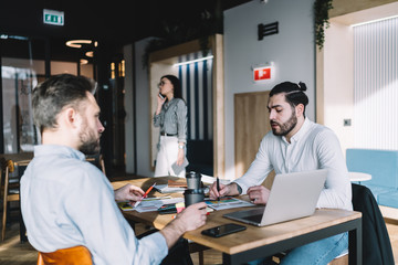 Colleagues analyzing business results of company