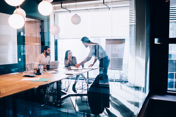 Business people sharing ideas in conference room