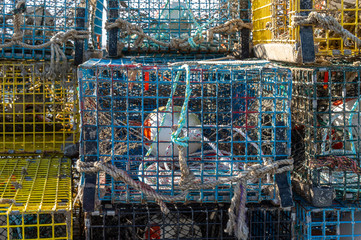 Labor-intensive preparation obvious in stack of lobster traps