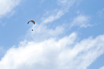 Paragliding in a blue sky