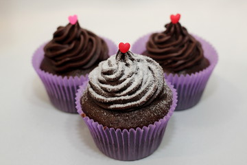 Three cup cakes in white background