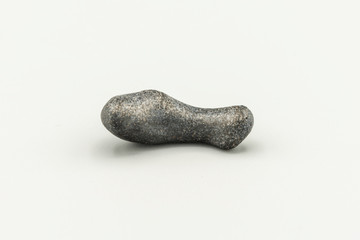 Black magnetic Atacaimite Tektite Meteorite isolated, a rock formed in a big meteorite collision at...