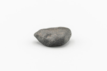 Black magnetic Atacaimite Tektite Meteorite isolated, a rock formed in a big meteorite collision at...
