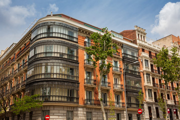 Architecture of the beautiful antique buildings at Calle de Antonio Maura in Madrid city center