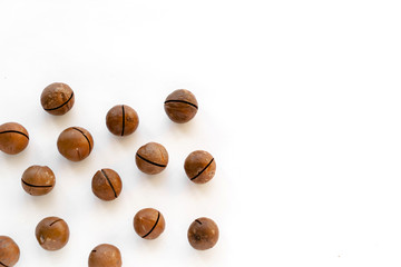 Macadamia nuts in the shell isolated on a white background close-up.