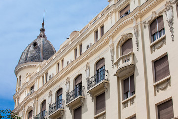 Architecture of the beautiful antique buildings at Calle Mayor in Madrid city center