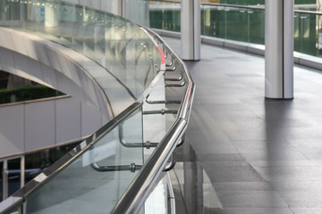 tempered glass of walk way balcony with stainless steel handrail.