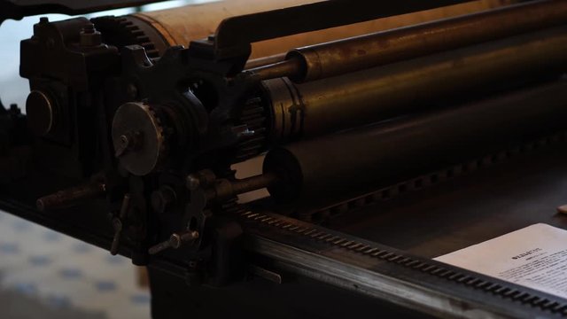 Old Gutenberg printing press machine, Soviet Russia. Vintage printshop, publication & typography, publishing industry. Retro rustic tools & machinery in factory.