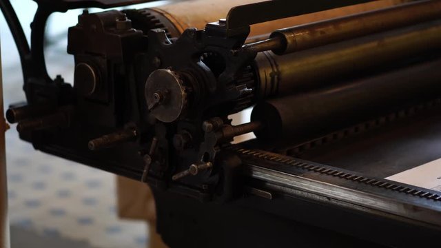 Vintage printing press, Soviet Russia. Old fashioned printshop, publication & typography, publishing industry. Retro tools & machinery in factory.