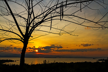 Sunrise morning with silhouette on lagoon and mountain