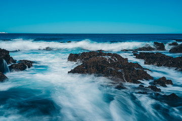 Fototapeta premium Long Exposure Of Sea Wave with rock