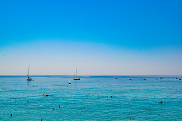 Fototapeta premium Boats at a calm sea in Cinque Terre Italy in a clean day