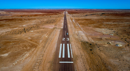 Emergency landing strip 23 is located on the highway 57km east of the outback town of Birdsville. These remote strips are used by the Royal Flying Doctor Service in emergency situations.