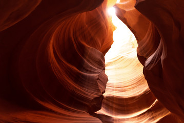 Unique & stunning Antelope Canyon located near Page, Arizona. Looking up into the famous tourist area during summer time with sun shining down through canyon walls  © Scalia Media