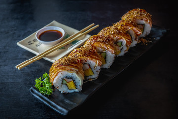  Salmon sushi roll, traditional Japanese food on black dish, Japanese food style, Sushi Menu, on black background, selective focus