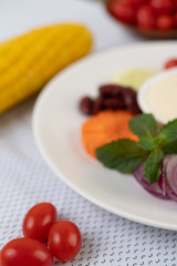 Ingredients for making salad and salad dressing in cups