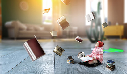 Little girl reading a book