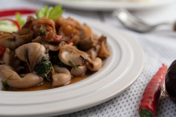 Stir fried basil with squid and shrimp, seafood style Thai food.