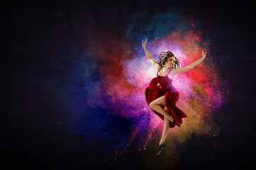 Young and beautiful female dancer in a red dress. Mixed media
