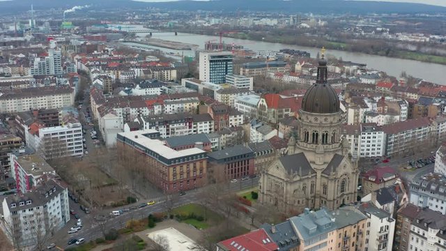 Aerial panorama rotating cinematic shot of Mainz and the christus church with the river rhine in the background 25p