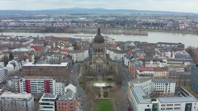 Aerial panorama fly over cinematic shot of the christus church in mainz with the river rhine in the background 30p