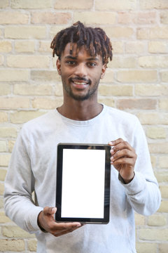 Young Man Holding a Digital Tablet Device. Isolated Screen.