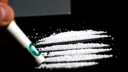 Cocaine lines on black background