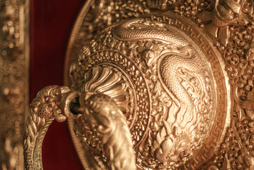 Close up of a door knocker in Bomdilla monastery, North east India