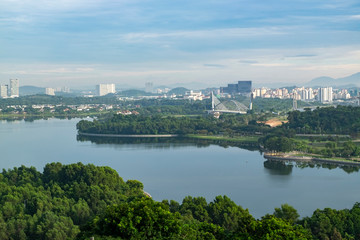 Fototapeta na wymiar Beautiful scenery Putrajaya city surrounding by lake over cloudy sky background